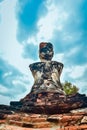 Old buddhist statue on old pagoda background Royalty Free Stock Photo